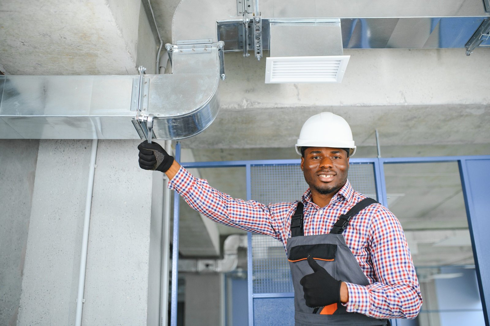 ventilation system installation and repair service. hvac technician at work. banner copy space.